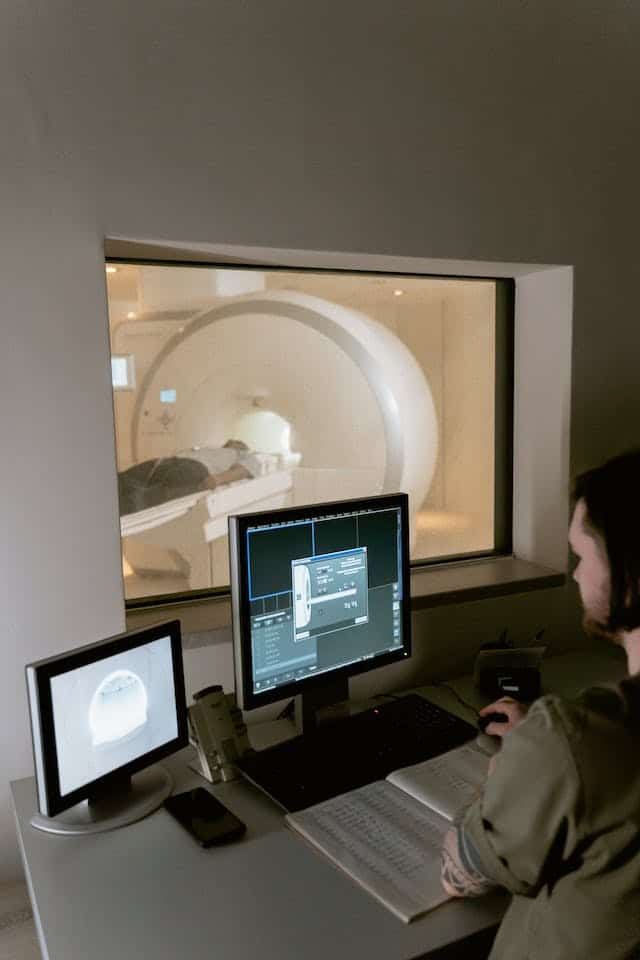 a doctor looking at mri results.