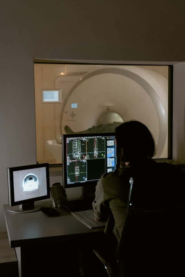 a doctor looking at mri results.