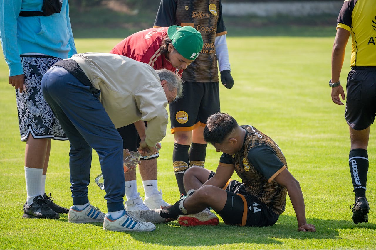 football sitting on floor injured