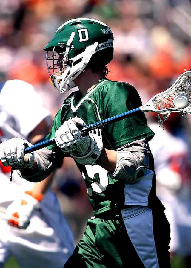 a man playing lacrosse