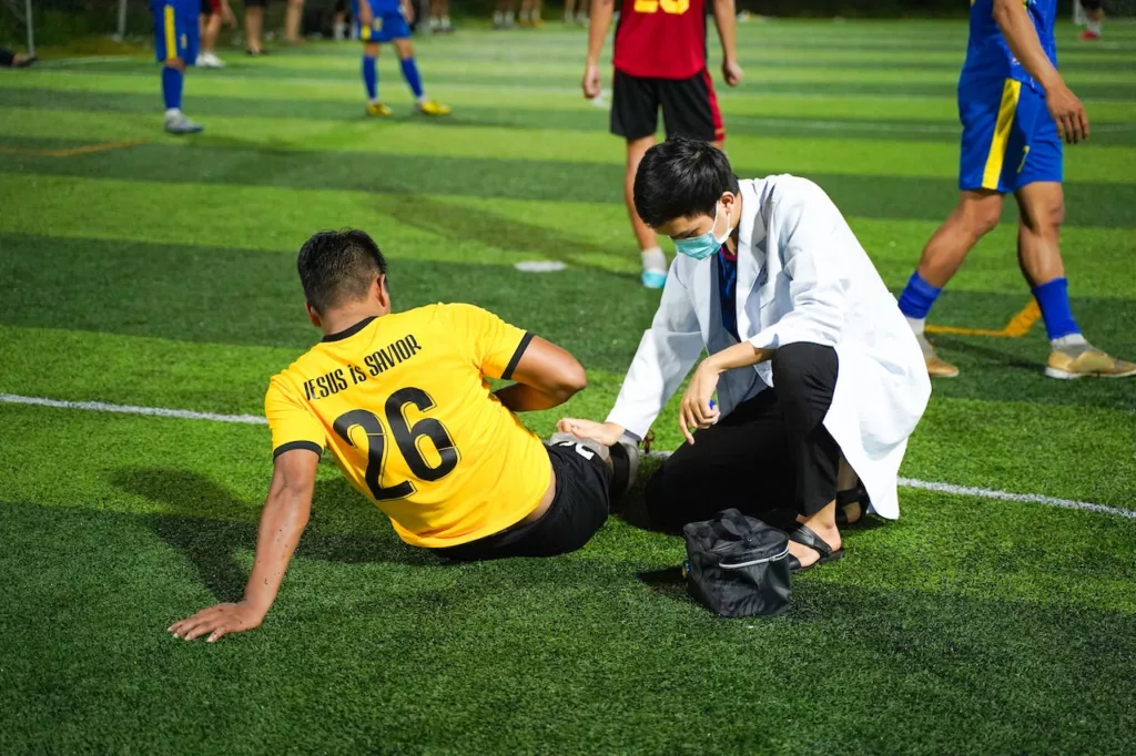 football sitting on floor injured