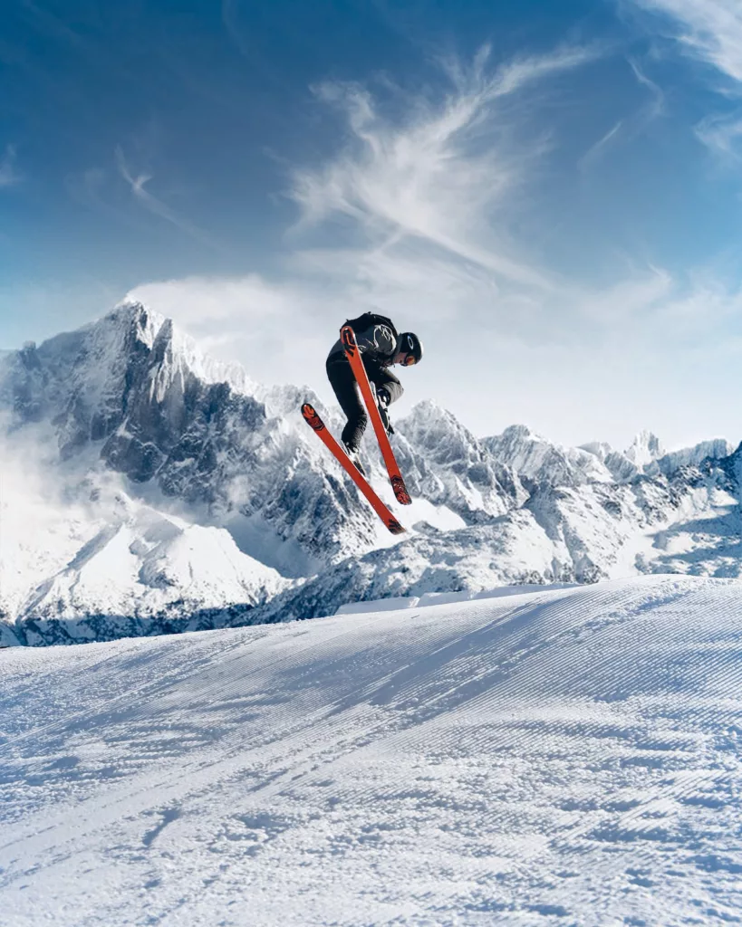 man jumping while skiing