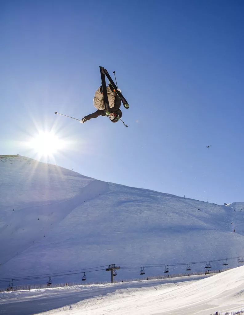 man jumping while skiing