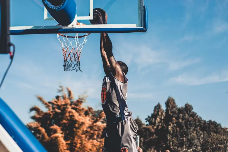 a man scoring in basketball