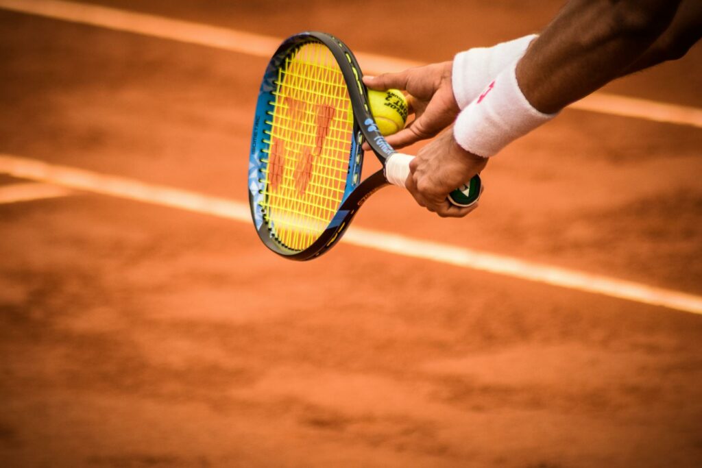 a racket with a player palying tennis